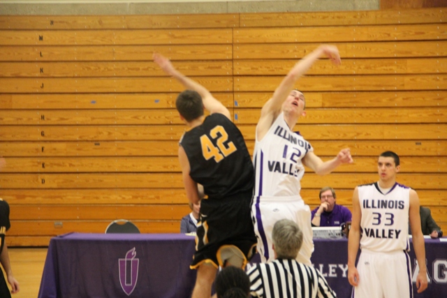 Michael Murray (12) and Jared Kuban (42) start the game off on Jan. 10 at IVCC against Black Hawk College. Jump ball