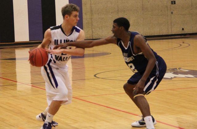 Kyle McLendon (21) protects the ball in a game against South Suburban on Jan. 7. Reach-in