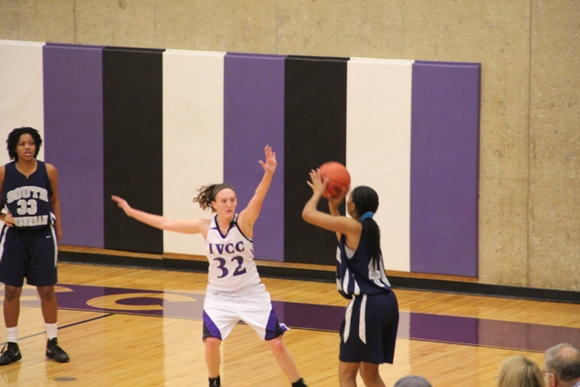 Joselynn Castelli (32) defends a shot from Sidnica Esco (41) during IVCC's win over South Suburban on Tuesday Jan. 7. Arms up!