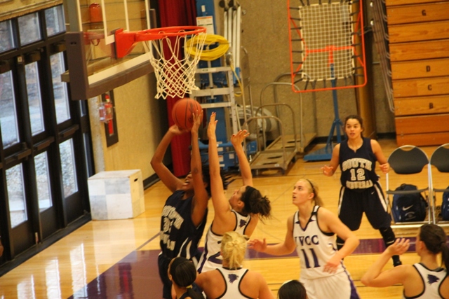 Dorotohy Taylor (31) goes in for a lay-up against the Eagles on Tuesday Jan. 7 as Julie Haye (22) and Alycia Welch (11) defend. IVCC went on to win the game 67-58. In the paint