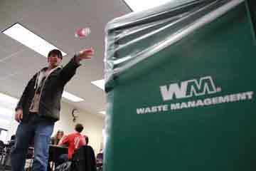 A students tosses an item into the new recycling bins on campus. The IV Sustainability group has helped to change IVCC’s recycling system to a new “single-stream recycling” system provided by Waste Management. 