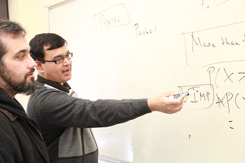 IV Leader photo/Kyle Russell
teaching honor
Abhijeet Bhattacharya, an IVCC economics instructor, explains a problem related to probability to Jason Sullivan in his Business Statistics class.  Bhattacharya recently won the Stephen Charry Memorial Award for the 2013 year.