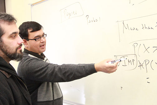 IV Leader photo/Kyle Russell
teaching honor
Abhijeet Bhattacharya, an IVCC economics instructor, explains a problem related to probability to Jason Sullivan in his Business Statistics class.  Bhattacharya recently won the Stephen Charry Memorial Award for the 2013 year.