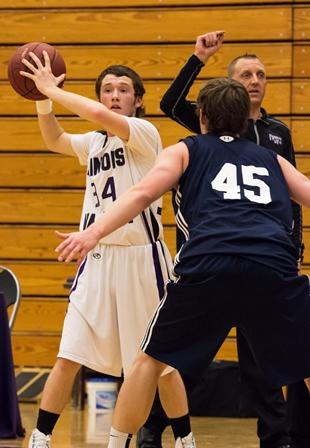 Nick Harsted, a baseball player from Ottawa who has recently joined the
Eagles men’s basketball team, looks to pass the ball inside during the
team’s Jan. 21 game vs. St. Ambrose JV. The Eagles won 81-60 and
Harsted finished with eight points.