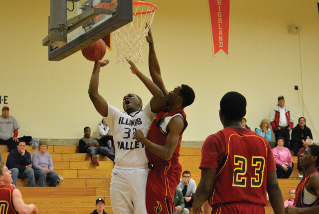 Torrance Johnson of Chicago’s Hope Academy goes up for a layup vs. Black Hawk East and takes a hard foul.
The Eagles won the game 67-60.