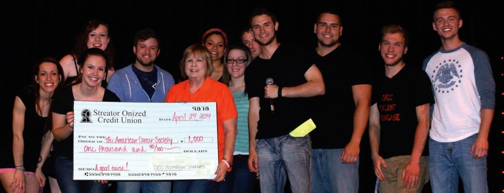 Hailey Shan (back, from left), Christiana Johnson, Brandon Miller; (front) Jade Atkinson, Andrea Neff, Cody
Zton, Nancy Jackson, Julianne Cameron, Philip Denner, Alex Danko, Tomasz Augustyniak and Cody Bornemann
award the check with the fund raising total at the end of the IV Talent Showcase on April 24. The Journalism
1002 class raised more than $1,000 for the American Cancer Society and presented the check to Jackson from
the Relay for Life, American Cancer Society.