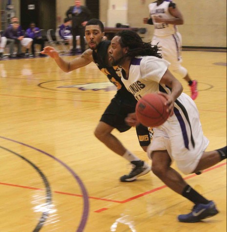 IVCC men’s basketball player Jazz Drane drives the ball past the Black Hawk defender. The Eagles would fall in the end by three; 66-69.