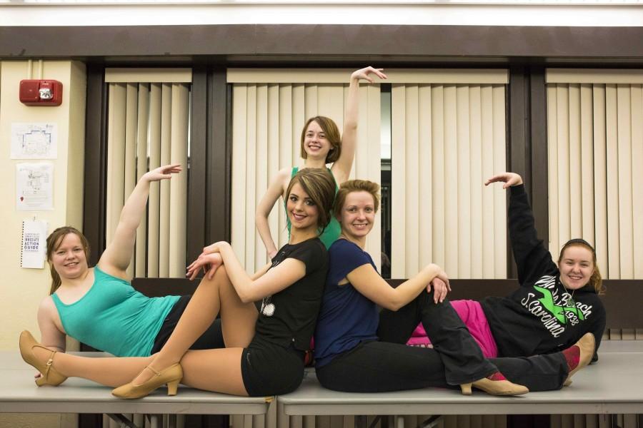 Cast members (left to right) Elizabeth Voitik, Emily Hanck, Anna Klobnak, Reilly Jaeger, and Emery Stewart pose during rehearsal. 