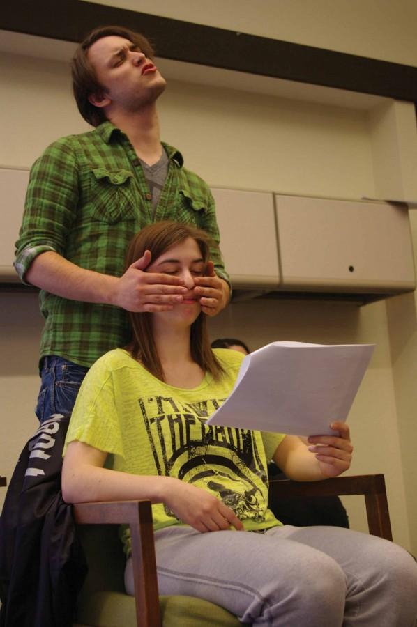 Leighton Williams (seated) teaches Jacob Jakielski about seeing the world without sight in a touching sketch that drew an enthusiastic applause from the rest of the troupe during rehearsal.