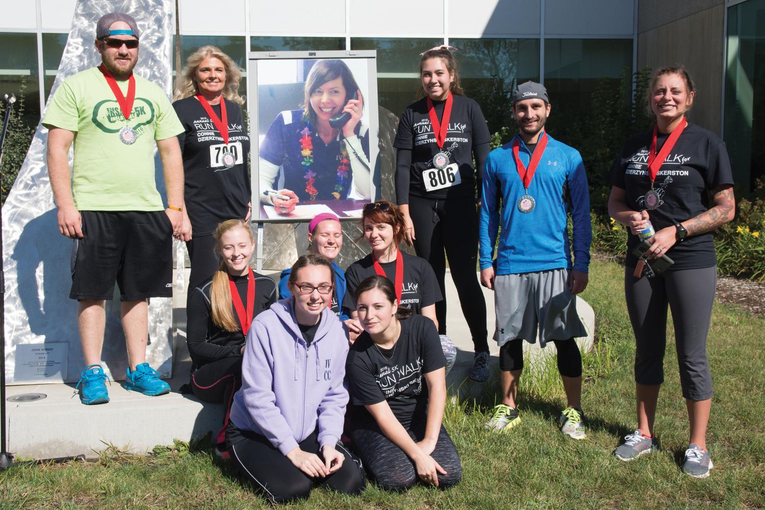 2016 5K winners pose with a picture of Skerston. This year’s event will take place Oct. 14. Runners, walkers and volunteers are needed.