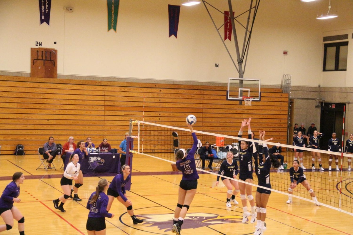 Freshman outside hitter Kaitlyn Edgcomb looks to spike it home against Rock Valley.