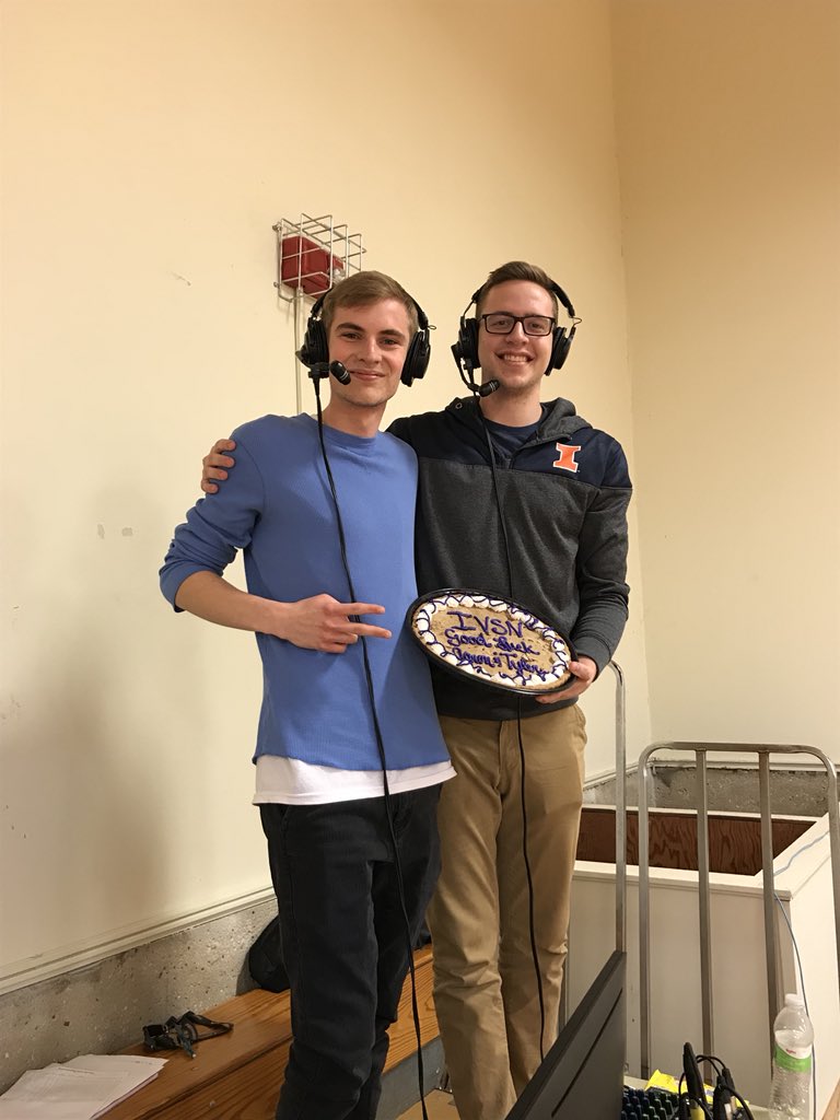 Sweet
sendoff
Aaron Pellican (left) and Tyler Towne enjoy a cookie cake during one of their last home broadcasts for the Illinois Valley Sports Network.