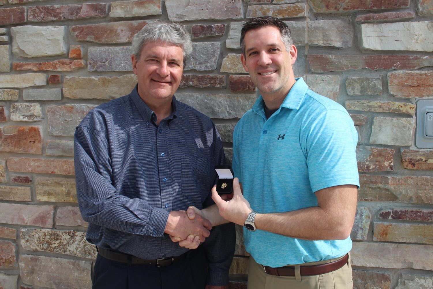 Thanks for the service
Dean of Natural Sciences and Business Ron Groleau (left) presents IVCC biology instructor Eric Schroeder (right) with a lapel pin in recognition of his service to Phi Theta Kappa.