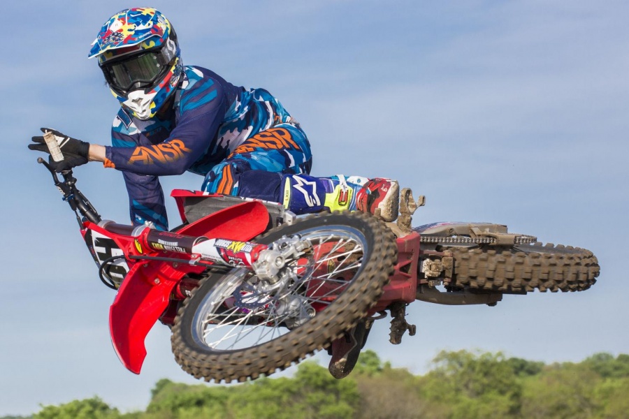 Motocross rider Justin Kelly demonstrates a technique called scrubbing, which involves riding his bike completely sideways midair to achieve the best possible aerodynamics. Kelly has been riding his whole life and now dedicates his time to training the youth of the sport.
