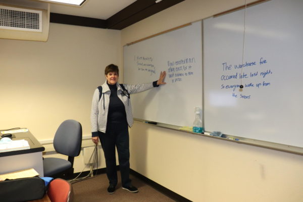 Jennifer Bubb spends one of her last class sessions at IVCC teaching students how to use coordinating conjunctions to create compound sentences. Bubb retires this year after 25 years at IVCC.
