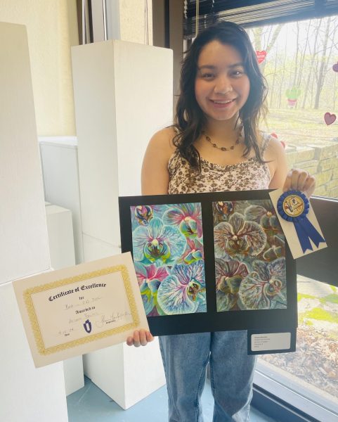 IVCC student Ariana Benitez, winner of Best in 2-D, with her work Anatomical Orchids. 