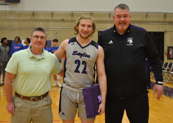 IVCC sophomore Wes Ruppert is recognized on sophomore night in the IVCC gym. He is joined by his stepfather Ryan Mickley and coach Chris Herman.