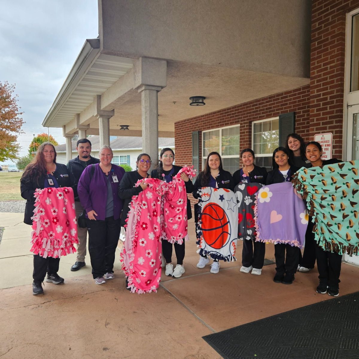 Photograph of IVCC student nurses, as well as SNA and Liberty Village representatives. From the left, Stacy Law, Liberty Village representative, IVCC nursing instructor Chrissy Boughton, Christine Wood, Leslie Sanchez, Katelyn Wilson, Jena Easton, Anna Larios, Liberty Village representative, and Coral Garcia.